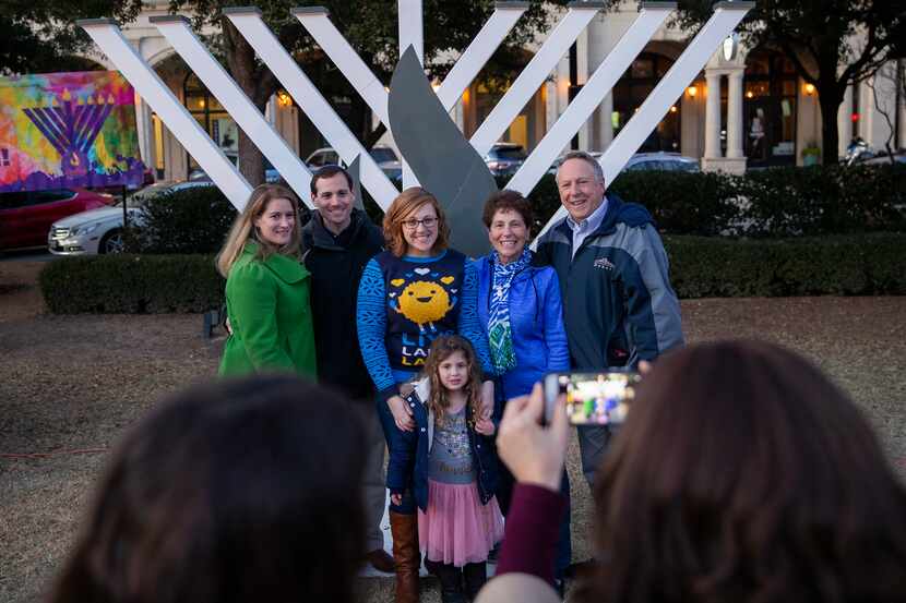 Families take a photo at the Chabad of Frisco’s 2019 menorah lighting. This year’s event,...