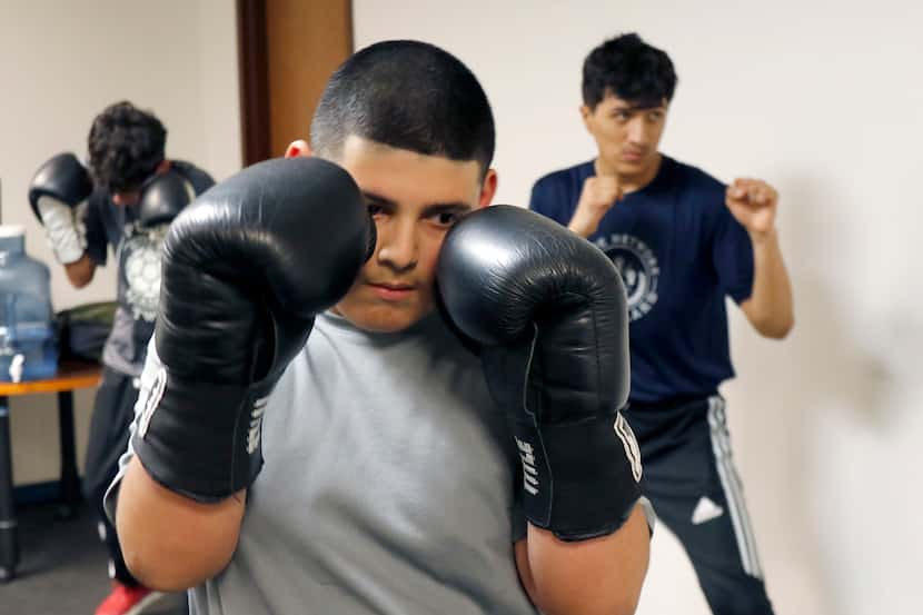 Daniel Abundis,12, is taking boxing classes to learn how to protect himself at the new...