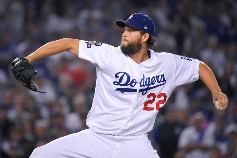 Los Angeles Dodgers pitcher Clayton Kershaw throws to a Washington Nationals batter during...