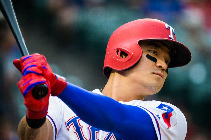 Texas Rangers right fielder Shin-Soo Choo (17) warms up before betting during the second...