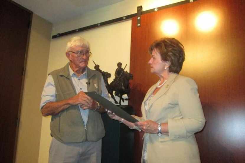 
Sculptor Robert Glen receives a proclamation from Rep. Linda Harper-Brown recognizing the...