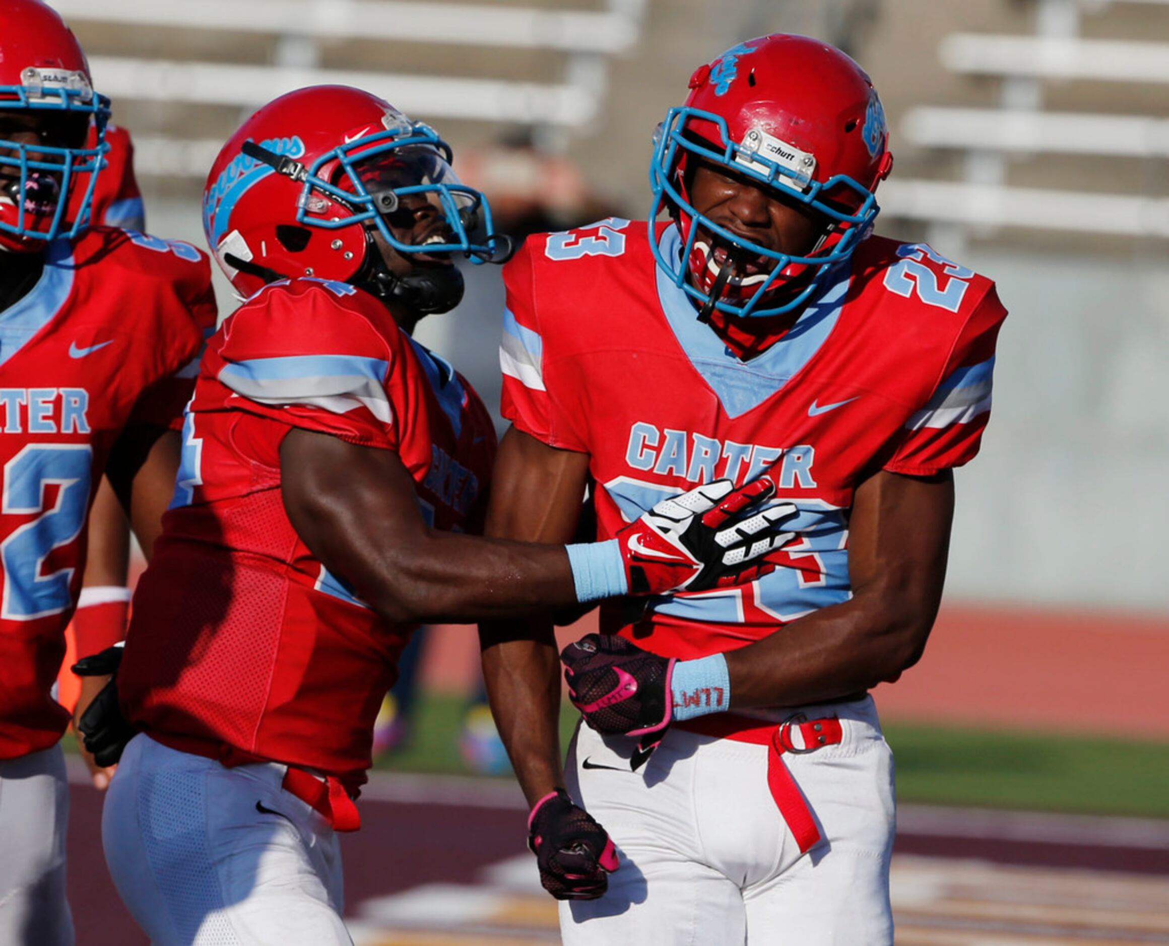 Dallas Carter's Jamalrian Jones (23) celebrates his rushing touchdown with Jaquallin Evans...