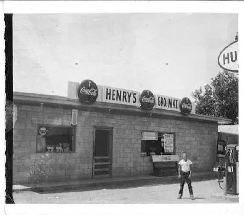 
Dennis Francis stands in front of his father’s store, Henry’s Grocery and Market.
