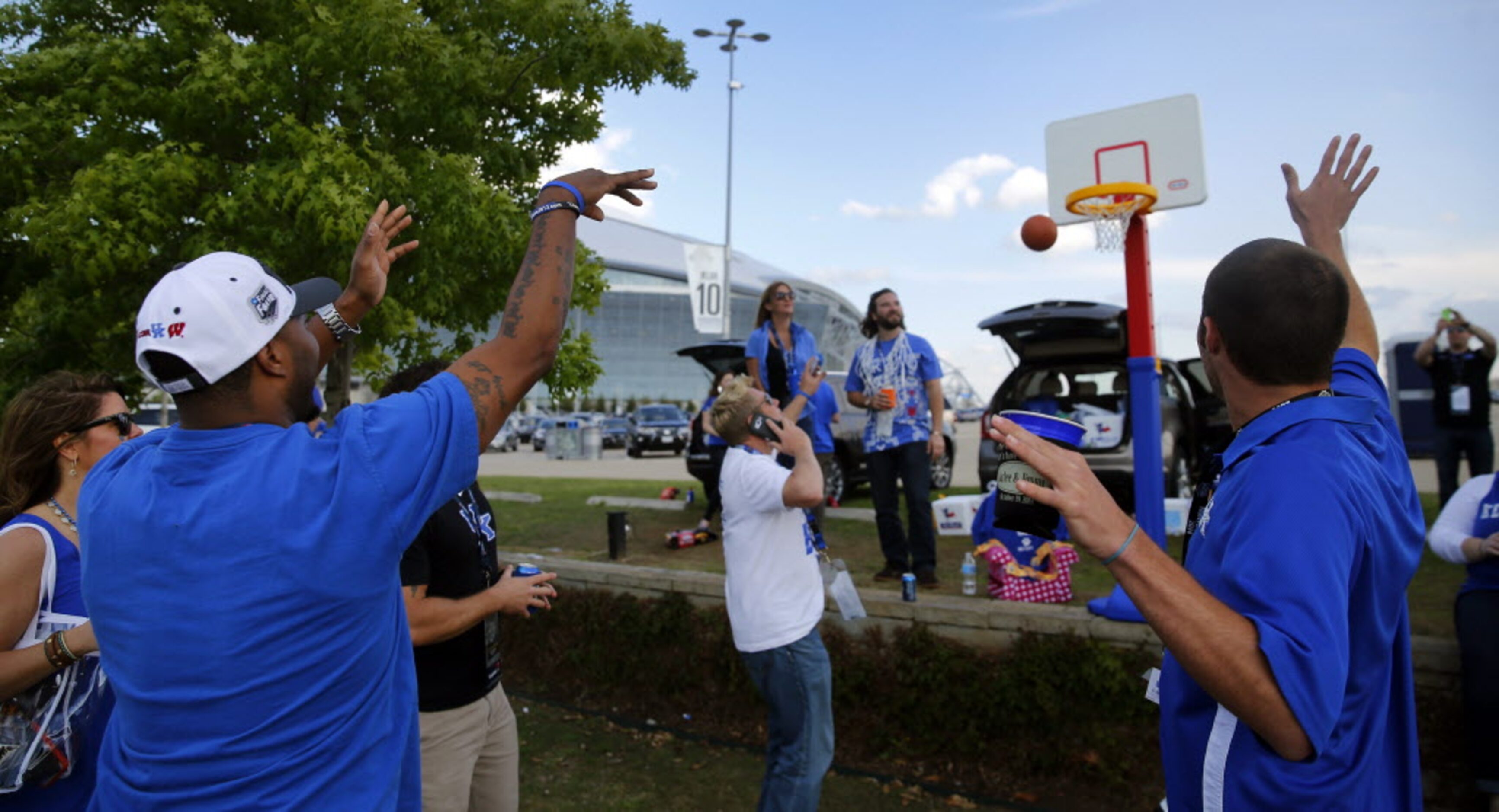 Quinton Smith of Ratcliff, KY shoots hoops outside AT&T Stadium in Arlington before the NCAA...