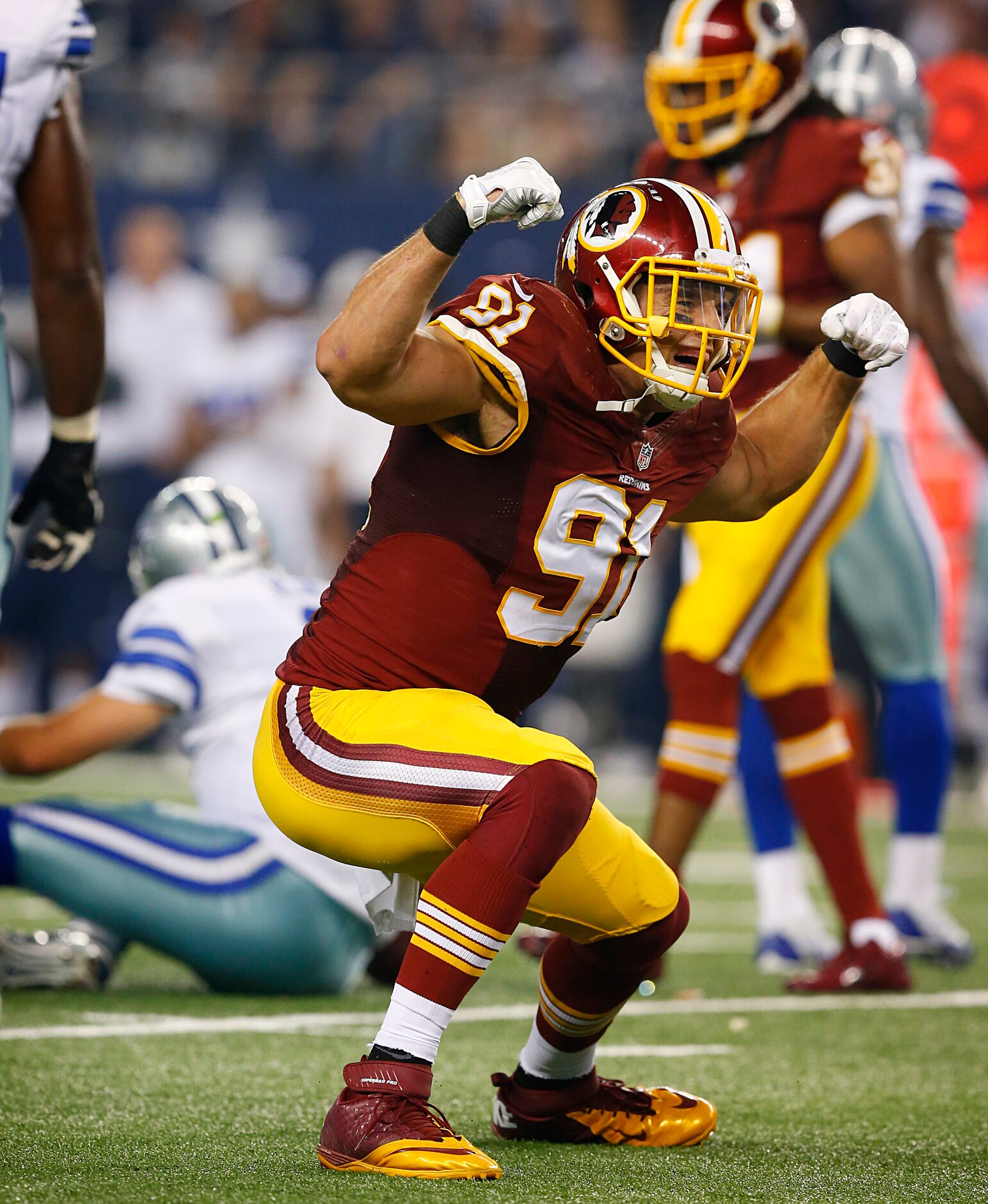 Washington Redskins outside linebacker Ryan Kerrigan (91) celebrates his sack of Dallas...