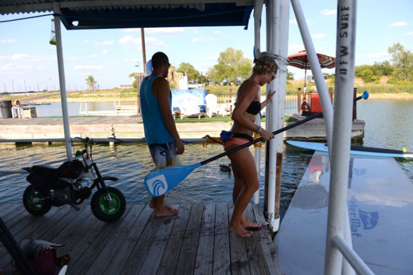 Paddleboard yoga instructor Kiley Fitzgerald prepares to lead a class on Lewisville Lake....