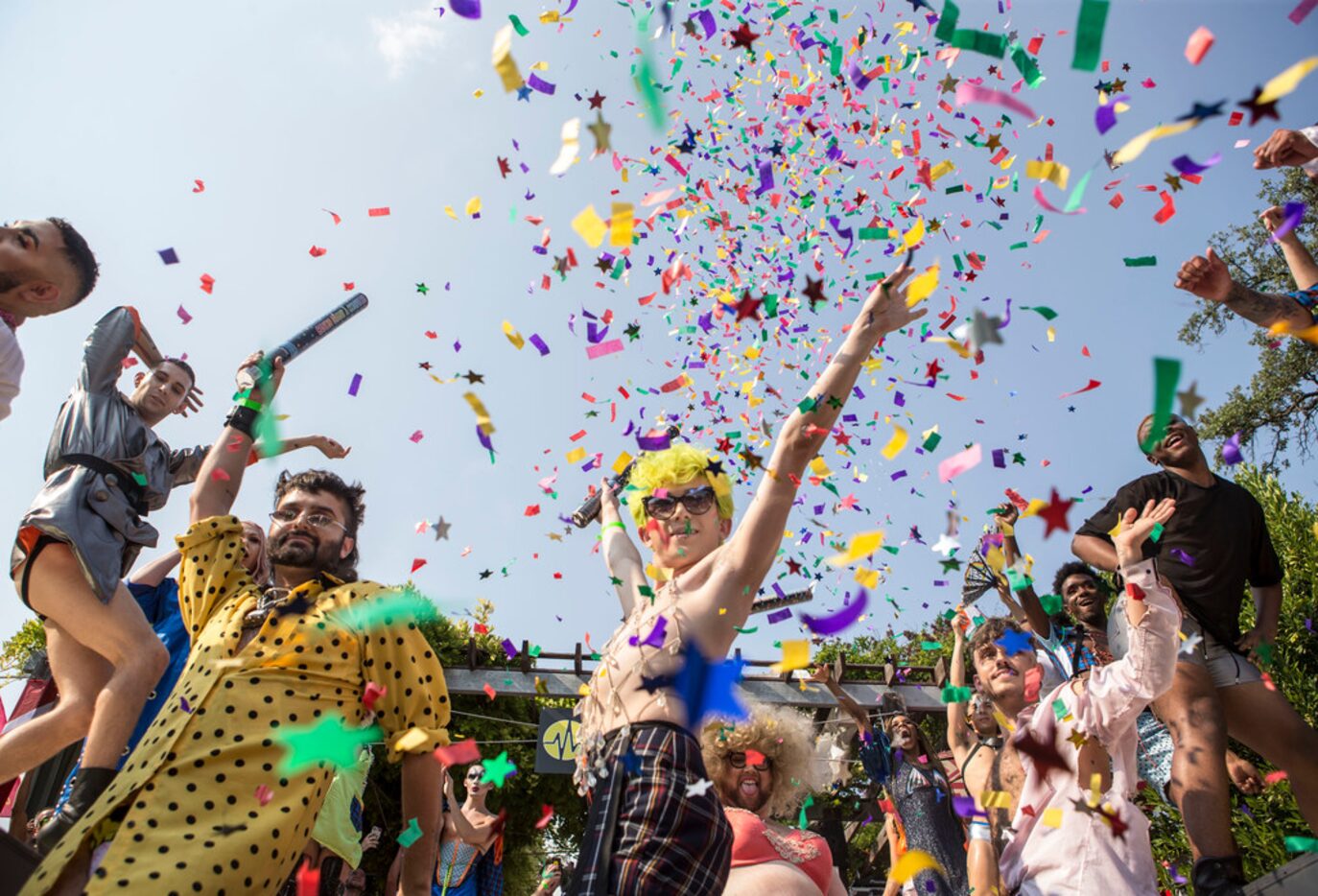 Hunter Crenshaw, left, and Caleb Feeney, center, of The House of Avalon celebrate the end of...