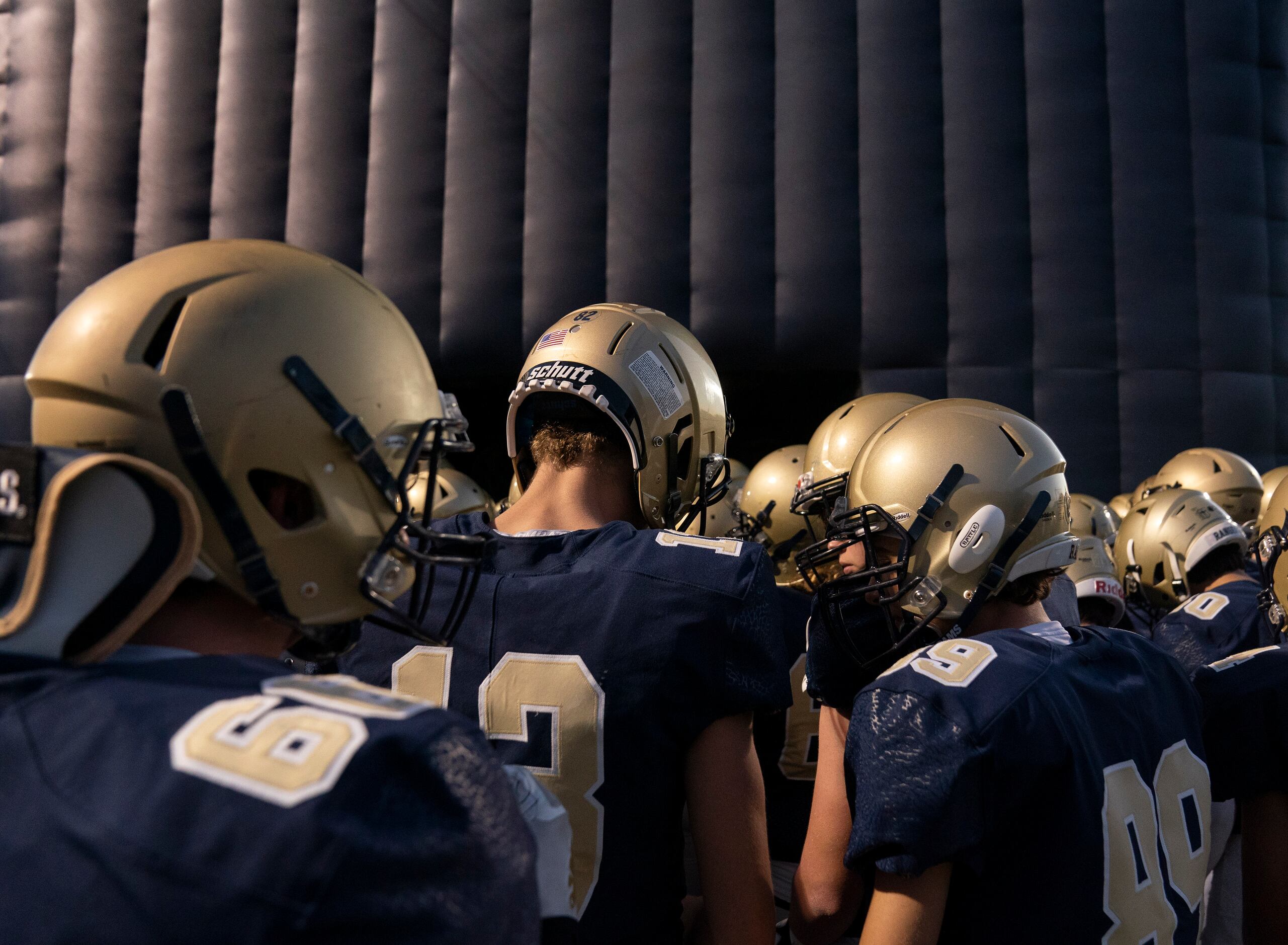 The Jesuit Rangers prepare to take the field before a high school football game against...