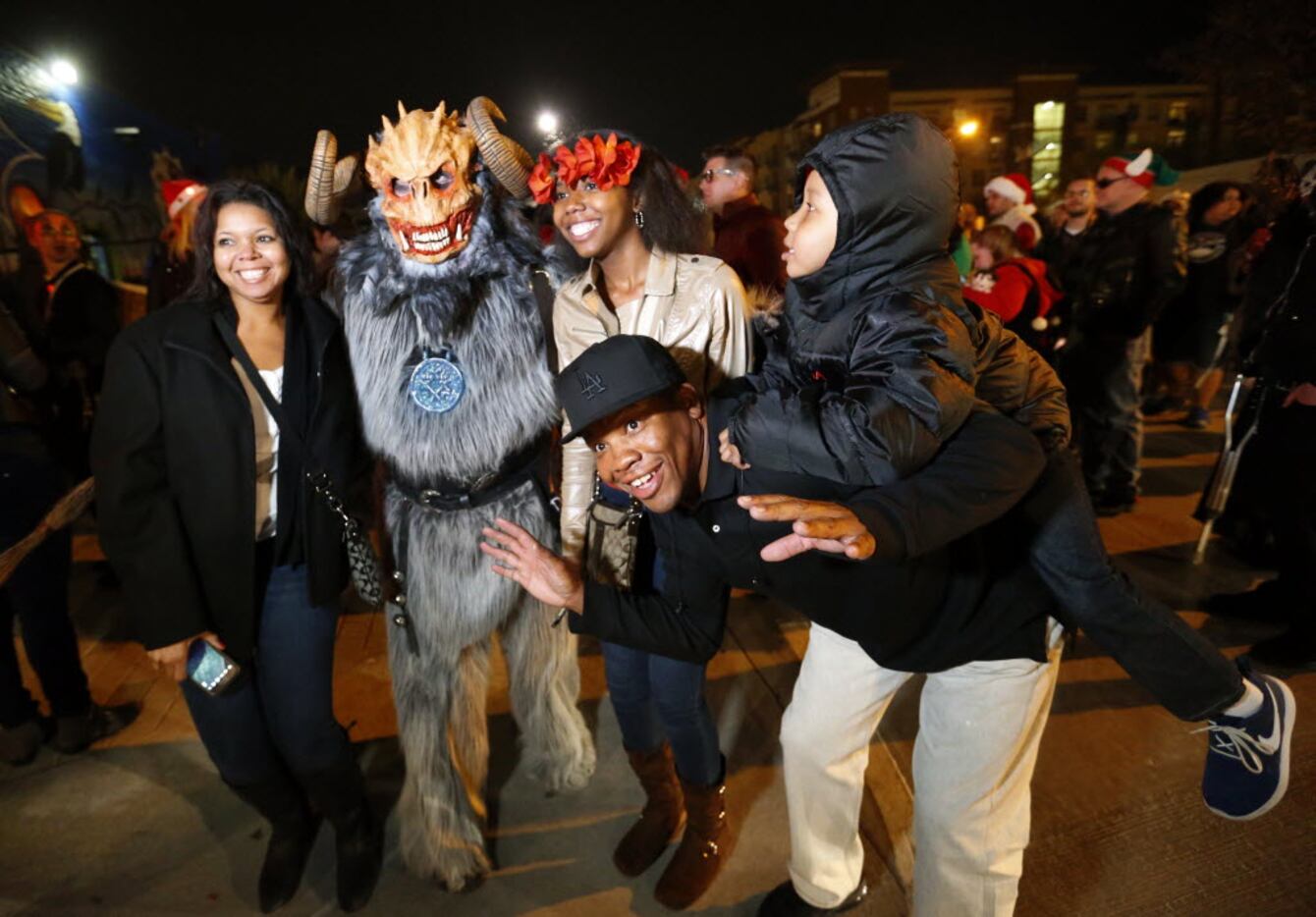 (from left) Veronica Wady, Krampus, Deja Lynch, Ray Lynch and R.J. Lynch pose for a family...