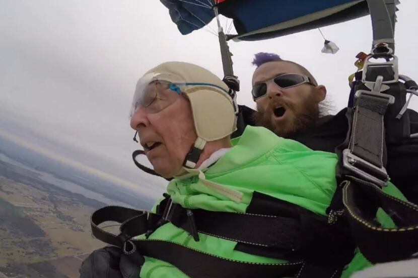 Blaschke making his historic jump with instructor Aaron Burwell of Skydive Temple, in...