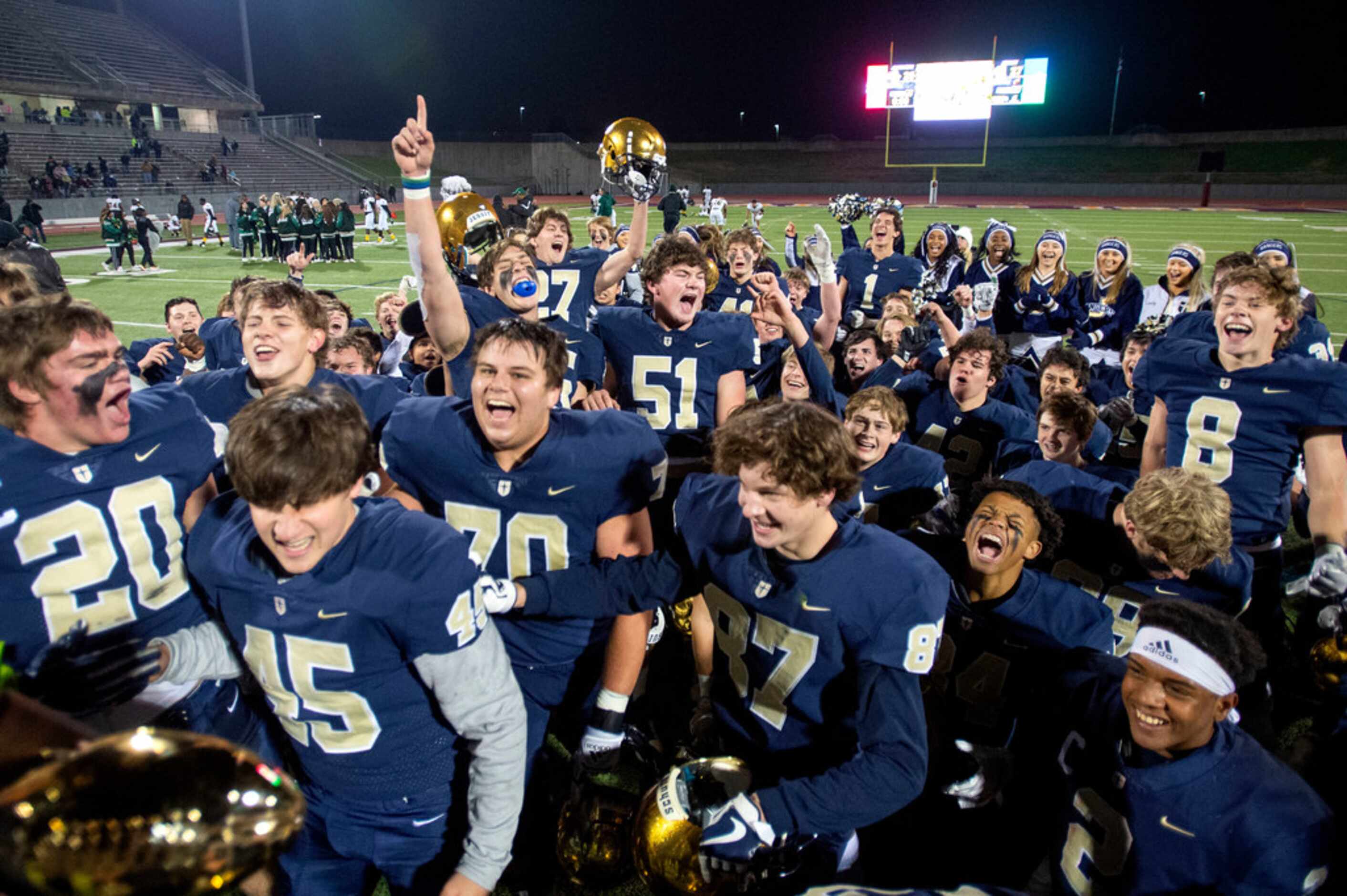 The Jesuit Rangers celebrate their 27-25 victory over defending state champions Longview in...