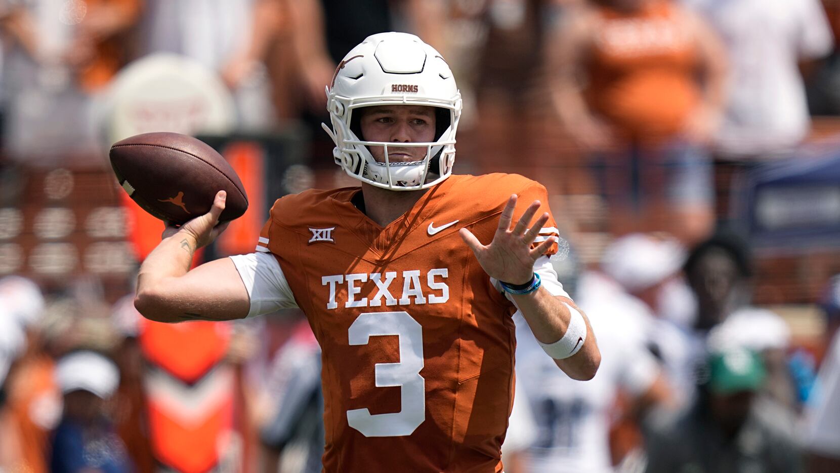 Texas quarterback Quinn Ewers (3) throws against Rice during the first half of an NCAA...