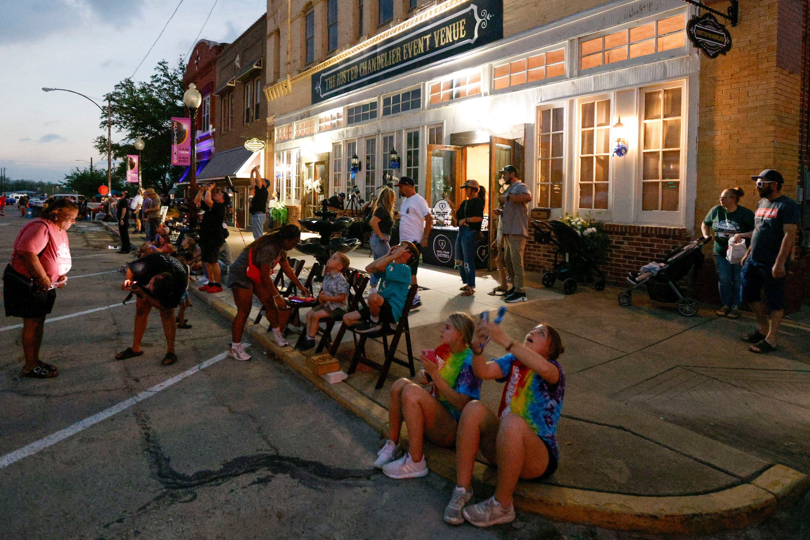 People look to the sky in the square to view a total solar eclipse, Monday, April 8, 2024,...