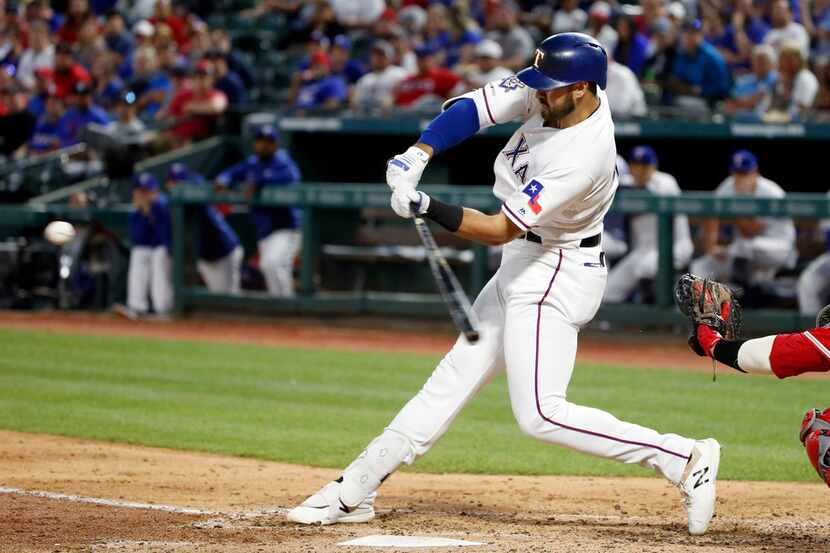 Texas Rangers' Joey Gallo hits a solo home run against the Los Angeles Angels during the...