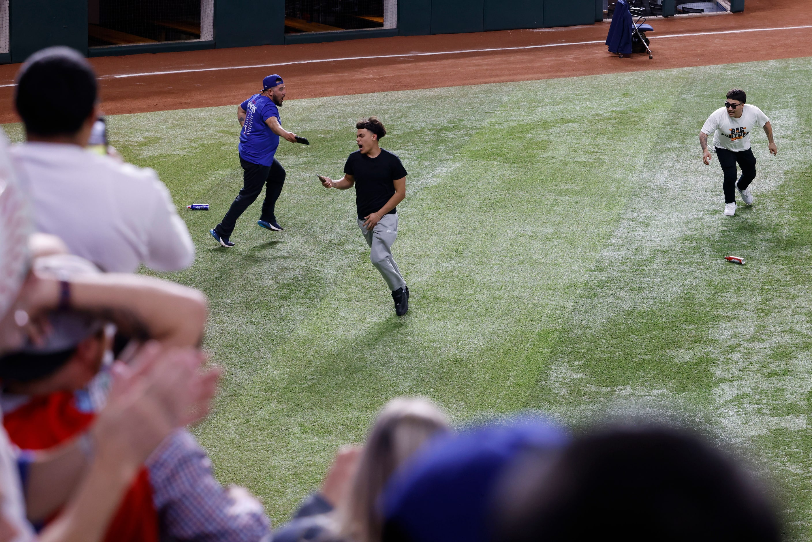 Some Texas Rangers fans ran onto the field following Texas Rangers’ winning the World Series...