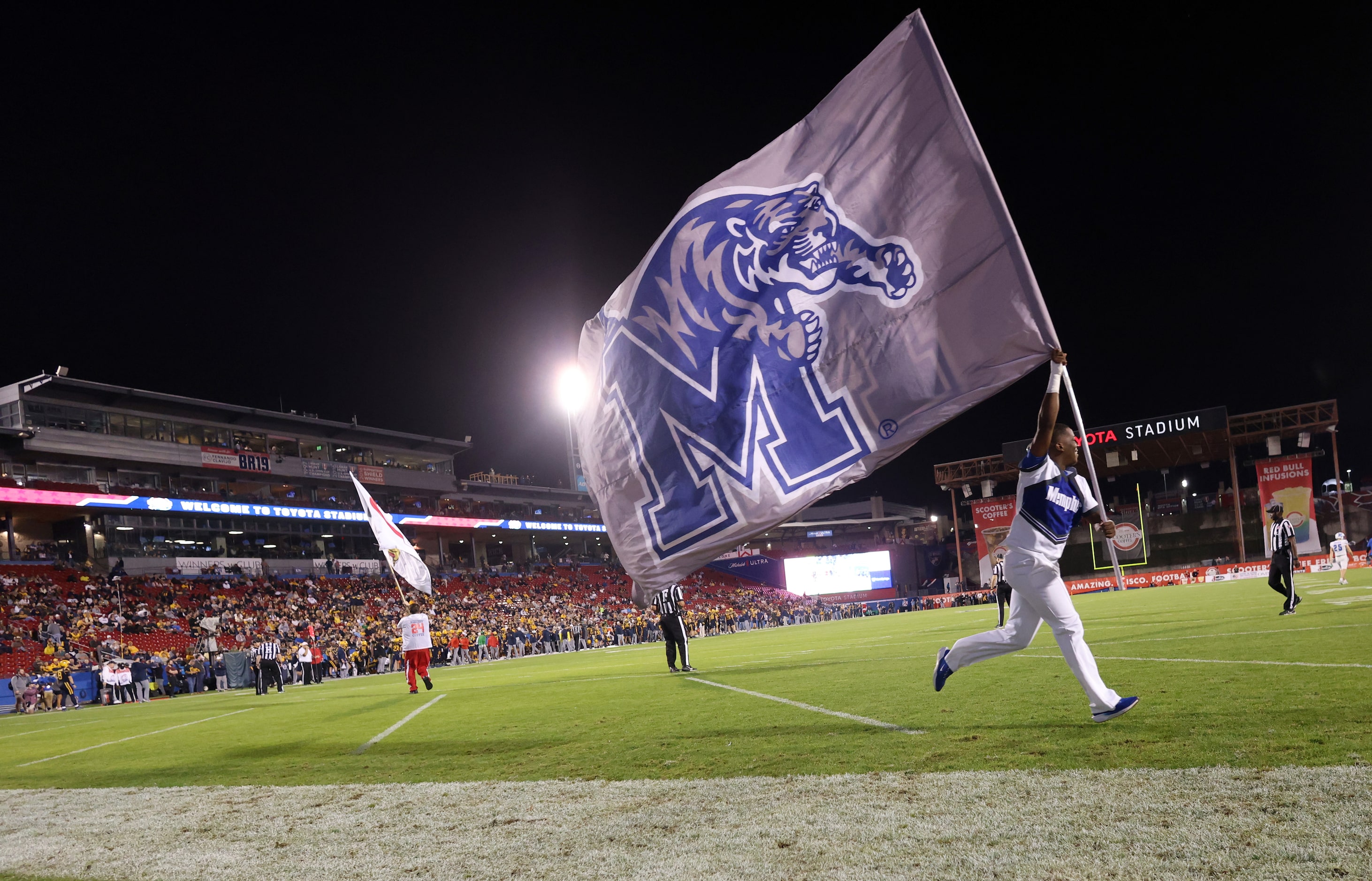 A Memphis flag runner races across the end zone following a first quarter Tigers touchdown...