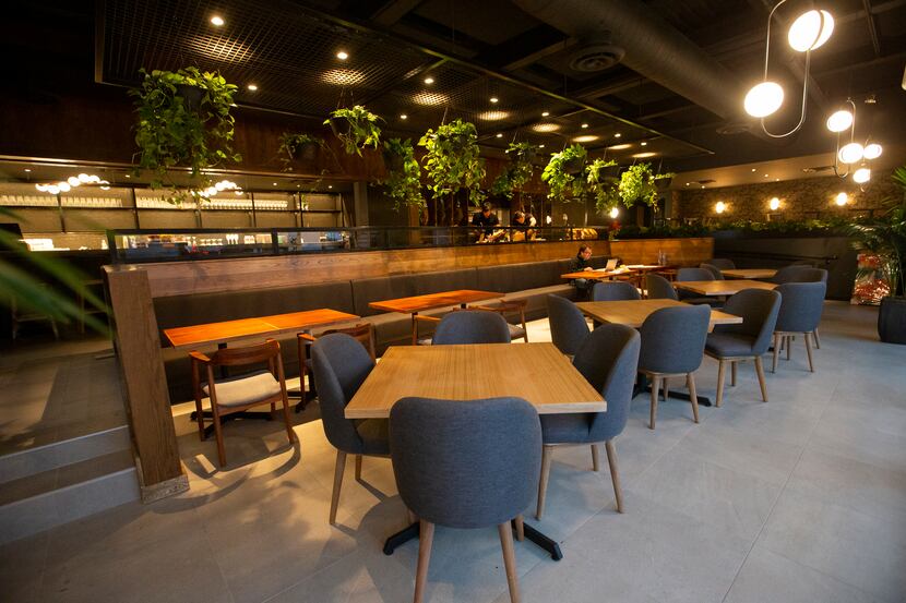 A dining area at the new Jamón Ibérico shop Enrique Tomás on Feb. 10, 2020 in Dallas. (Juan...