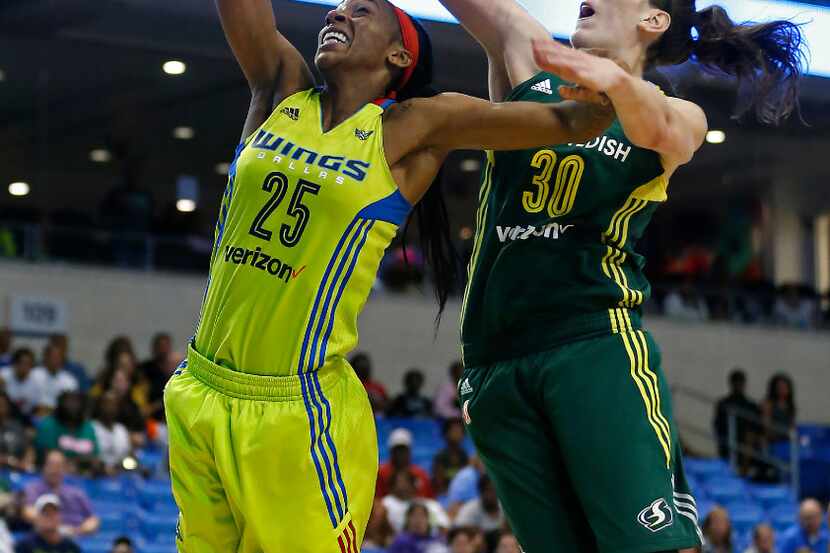 Dallas Wings forward Glory Johnson (25) has her layup blocked by Seattle Storm forward...