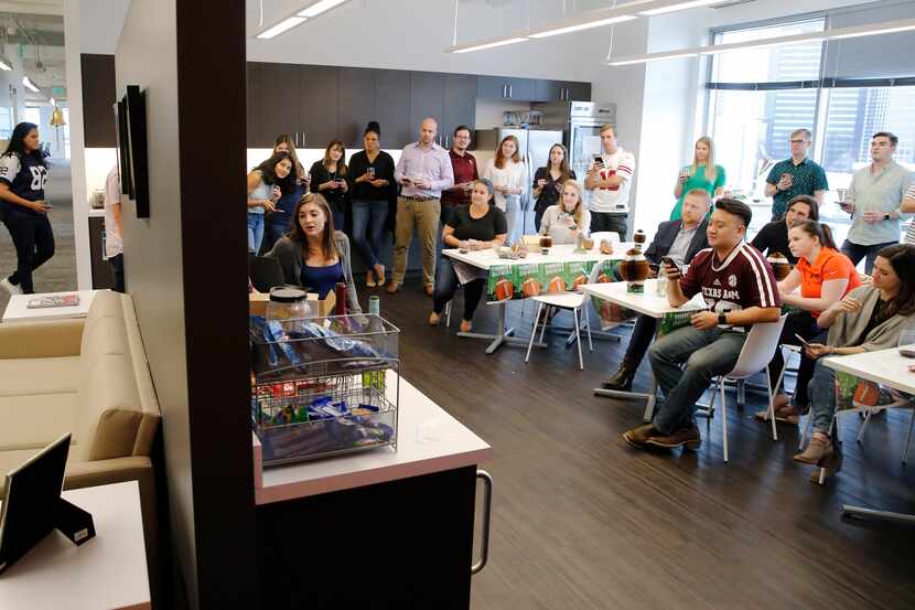 Employees took a football quiz during a Fantasy Football Draft Fun Friday Happy Hour at West...