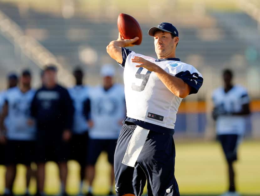 Dallas Cowboys quarterback Tony Romo (9) launches a pass during an afternoon walk thru at...