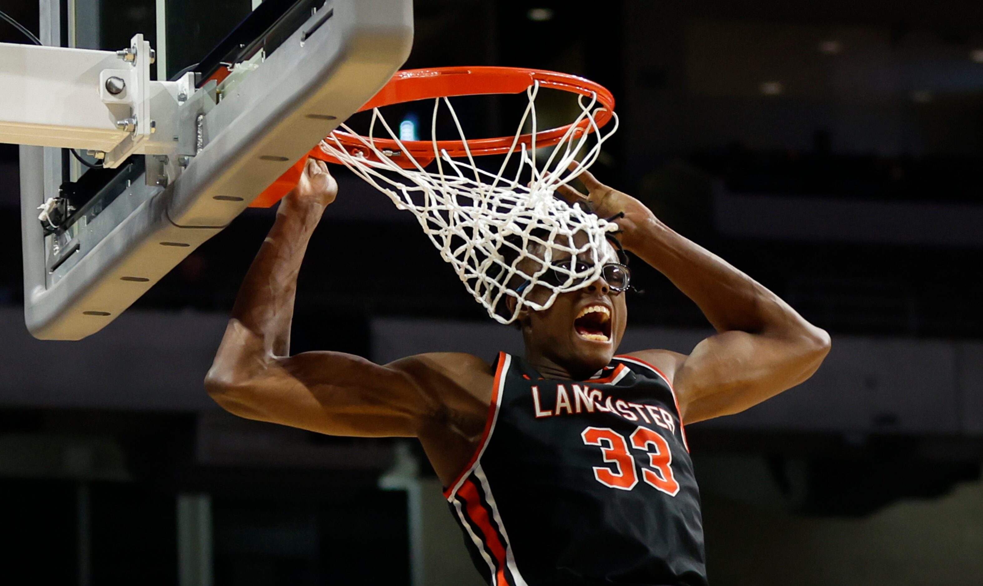 Lancaster's Amari Reed (33) dunks in the second half of the UIL Class 5A boys basketball...