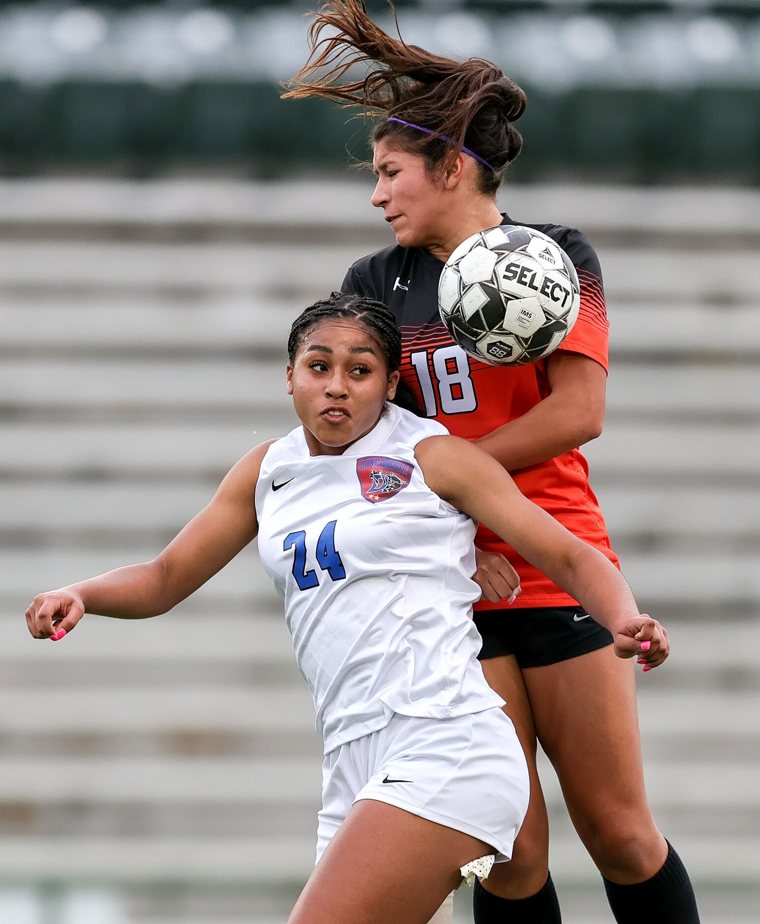 Duncanville Halle Garcia (24) and Rockwall Mia Nunez (18) go for a loose ball during the...