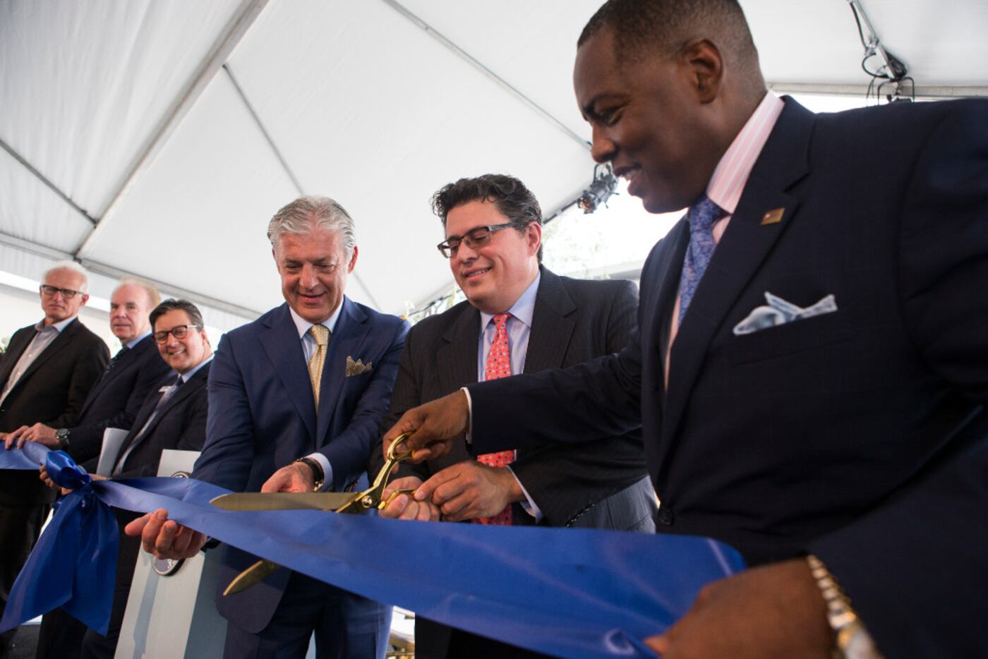 Plano Mayor Harry LaRosiliere, right, Secretary of State Rolando Pablos, and developer Fehmi...