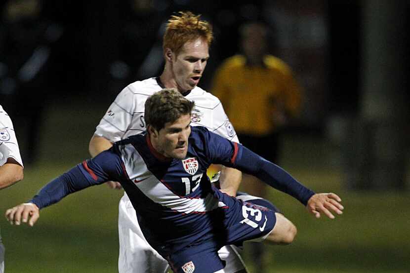 Greg Garza, a Grapevine product and member of the U.S. Under-23 National Team is tackled by...