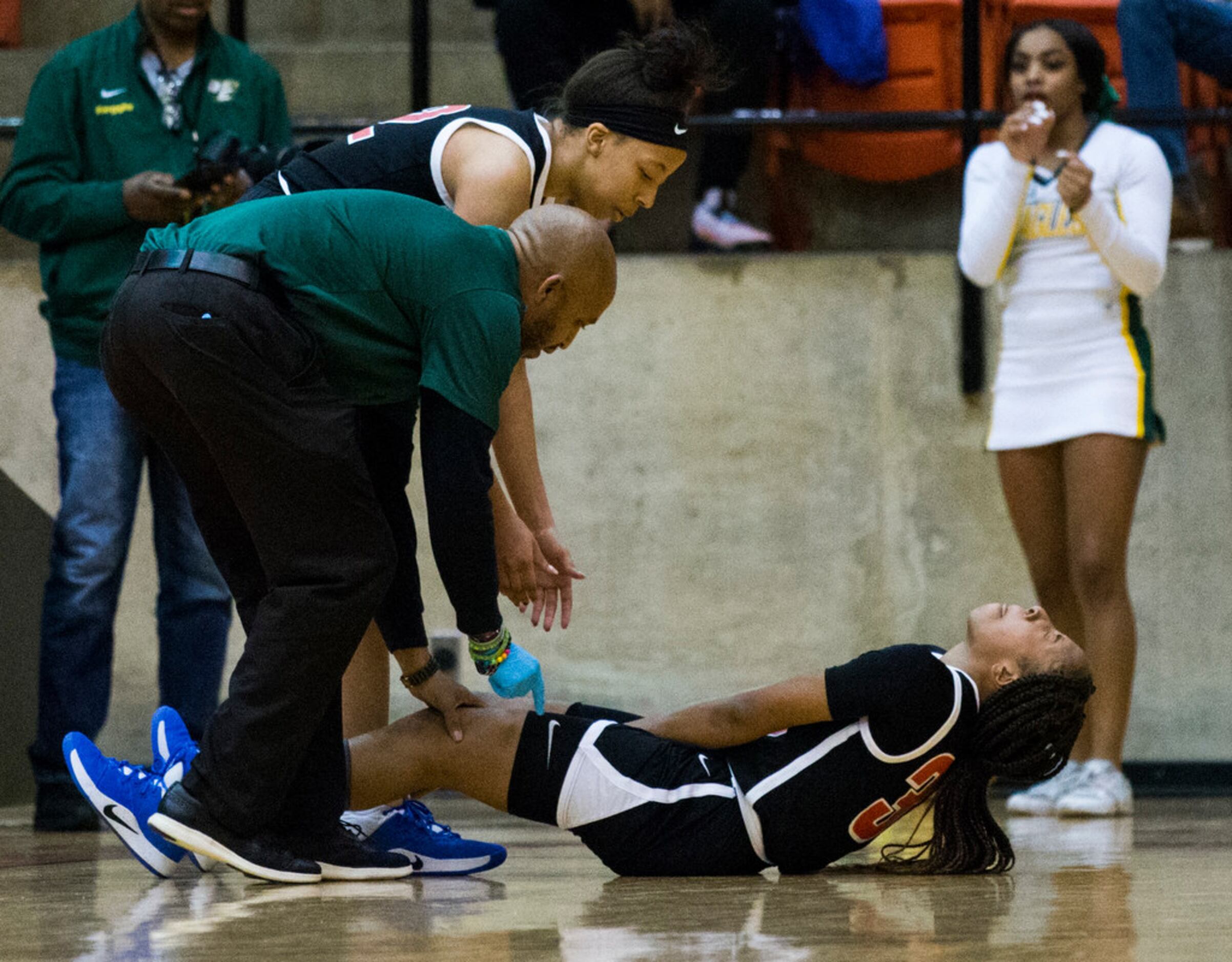 Duncanville's Nyah Wilson (33) reacts to an injury during the fourth quarter of a Class 6A...