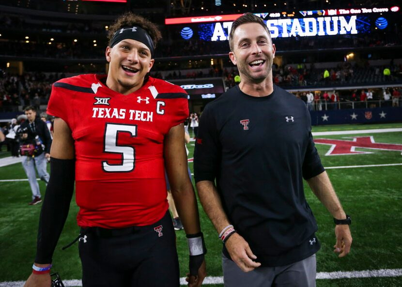 Texas Tech quarterback Patrick Mahomes II (5) and head coach Kliff Kingsbury walk off the...