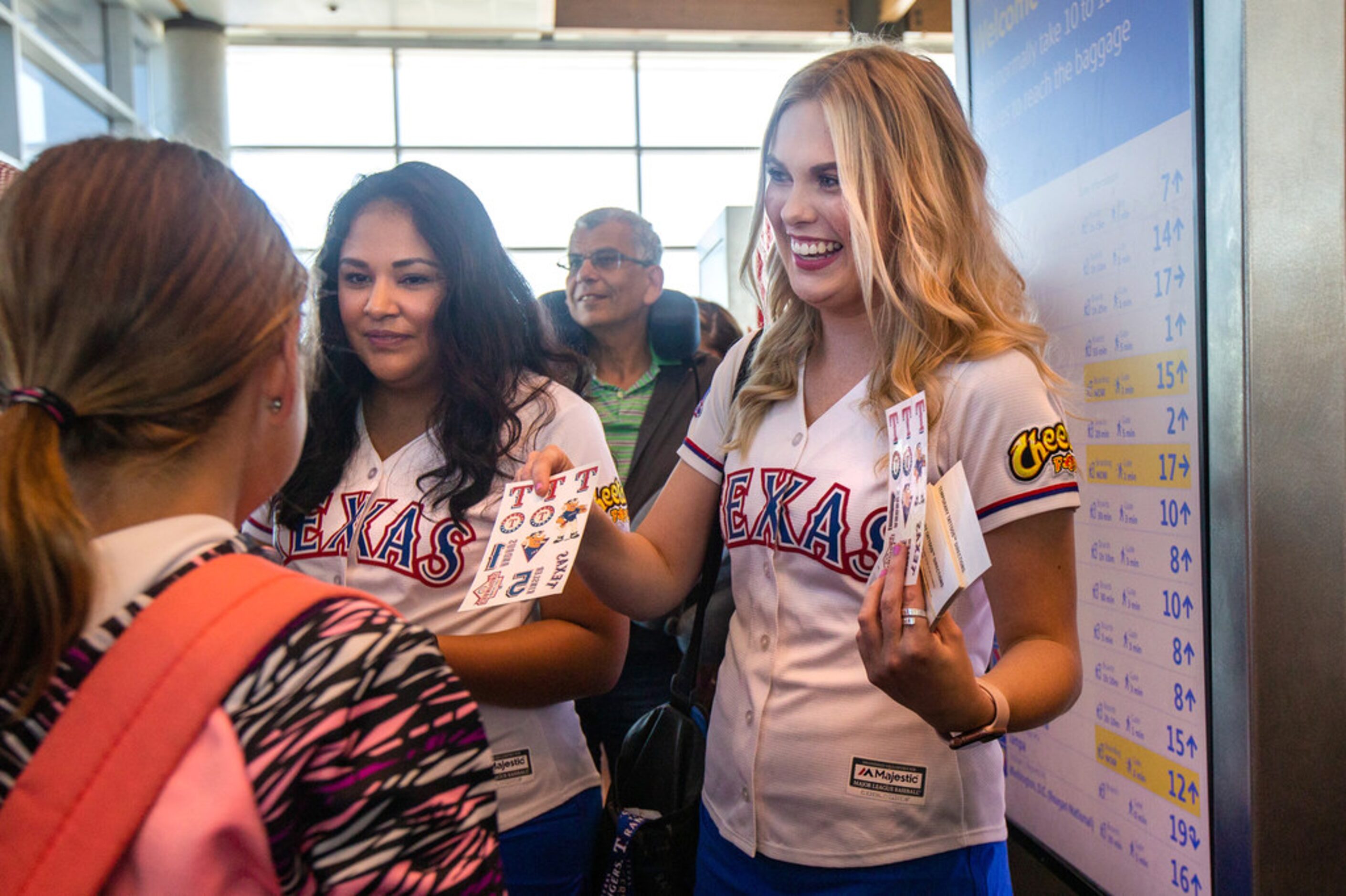 Members of the Texas Rangers Six Shooters squad Allie Garriott (right) and Victoria Navarro...