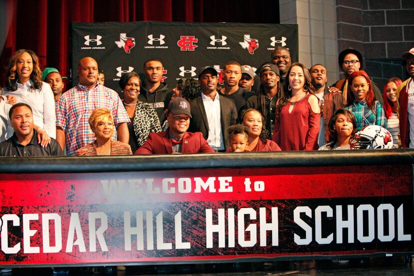 Cedar Hill wide receiver Camron Buckley, wearing bowtie, sits with his friends and family...