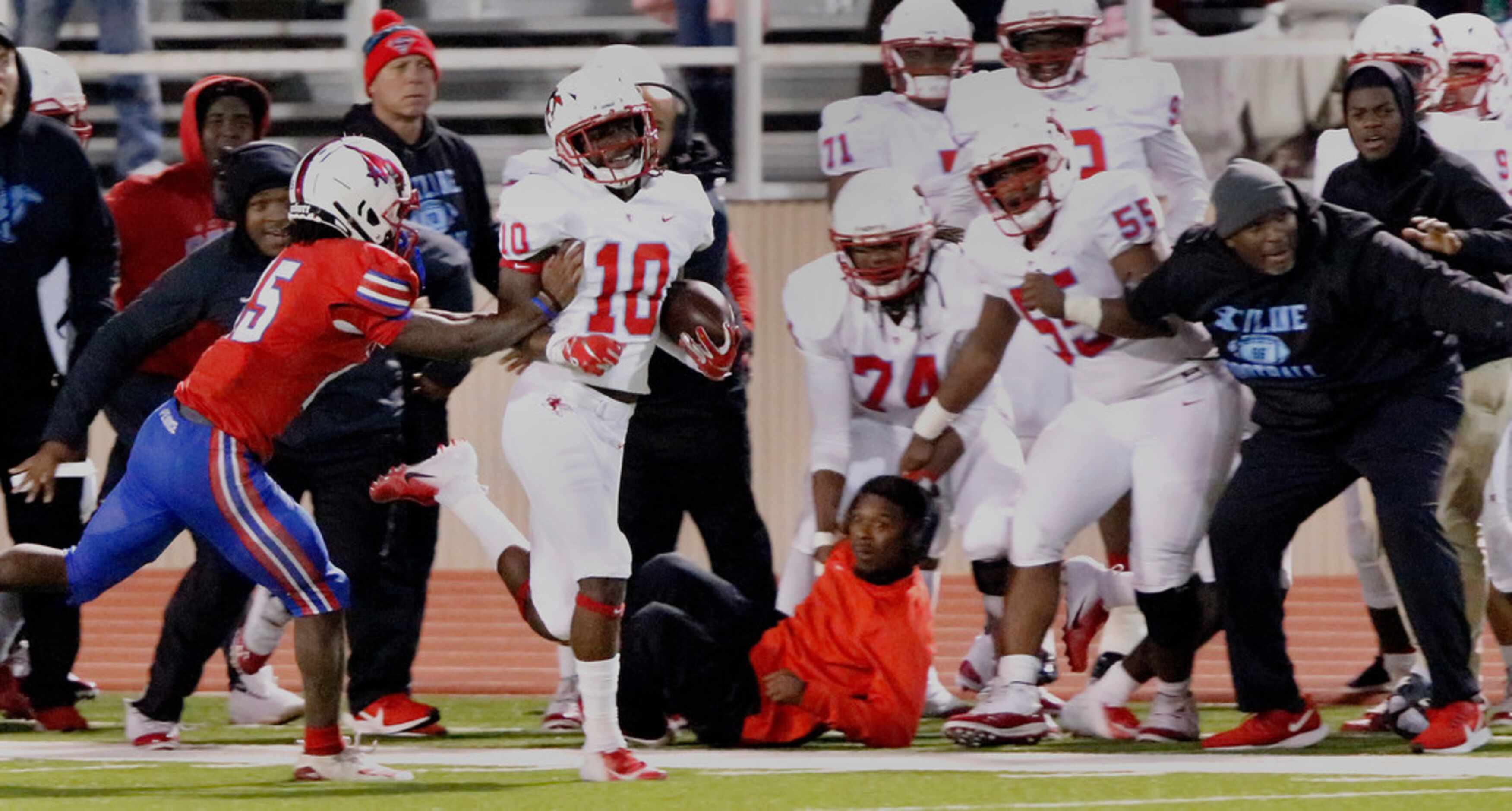 Skyline High School cornerback Milton Roundtree (10) is shoved out of bounds by J.J. Pearce...
