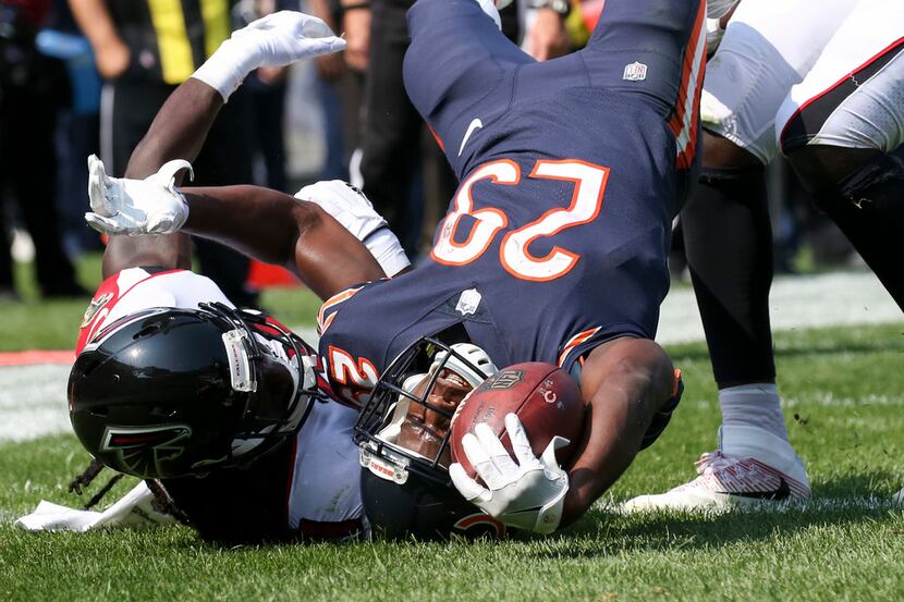 Atlanta Falcons cornerback Desmond Trufant (21) tackles Chicago Bears running back Tarik...