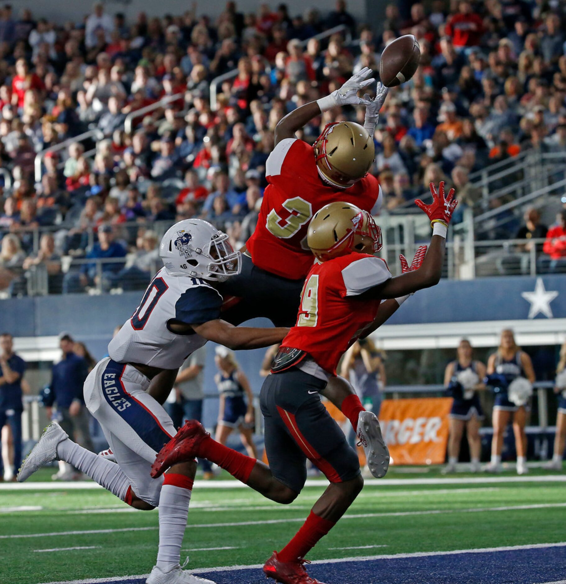 South Grand Prairie's Craig Woodson (33) breaks up a pass intended for Allen's Theo Wease...