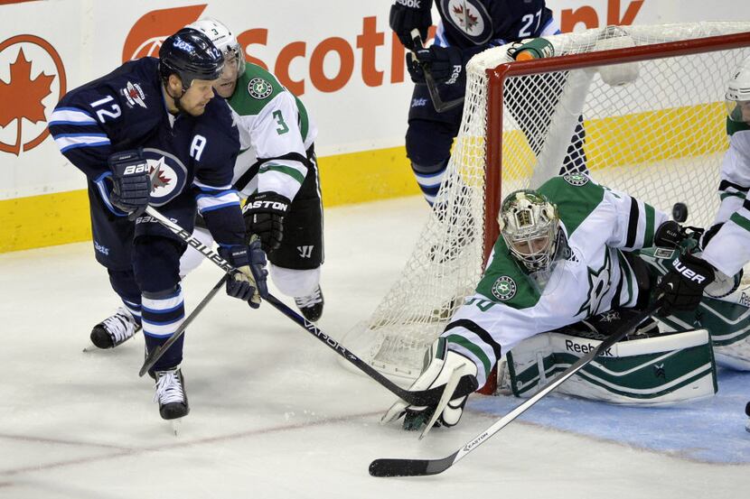 Oct 11, 2013; Winnipeg, Manitoba, CAN; Dallas Stars goaltender Dan Ellis (30) makes a save...