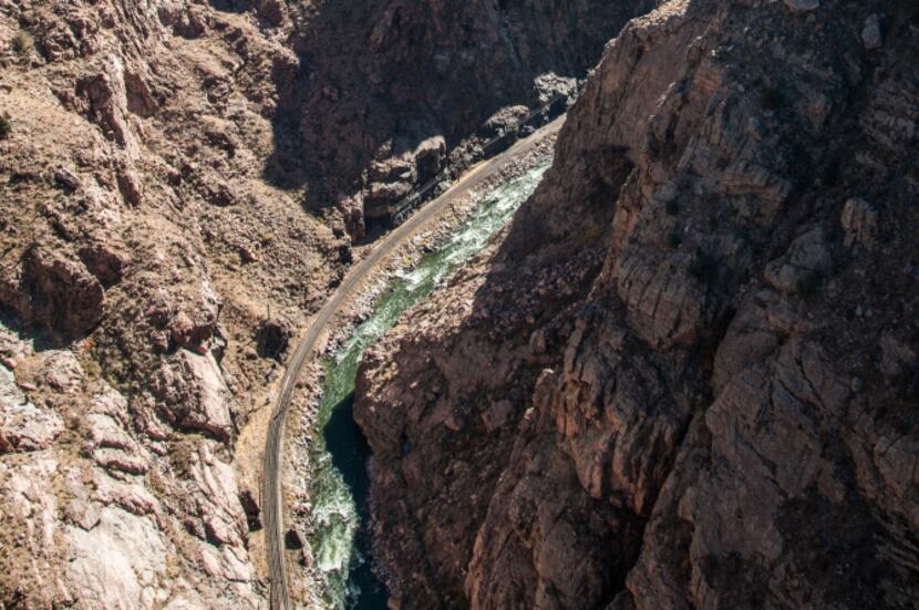 At it's narrowest, Royal Gorge in Colorado becomes a cliff-hemmed corridor with tracks...