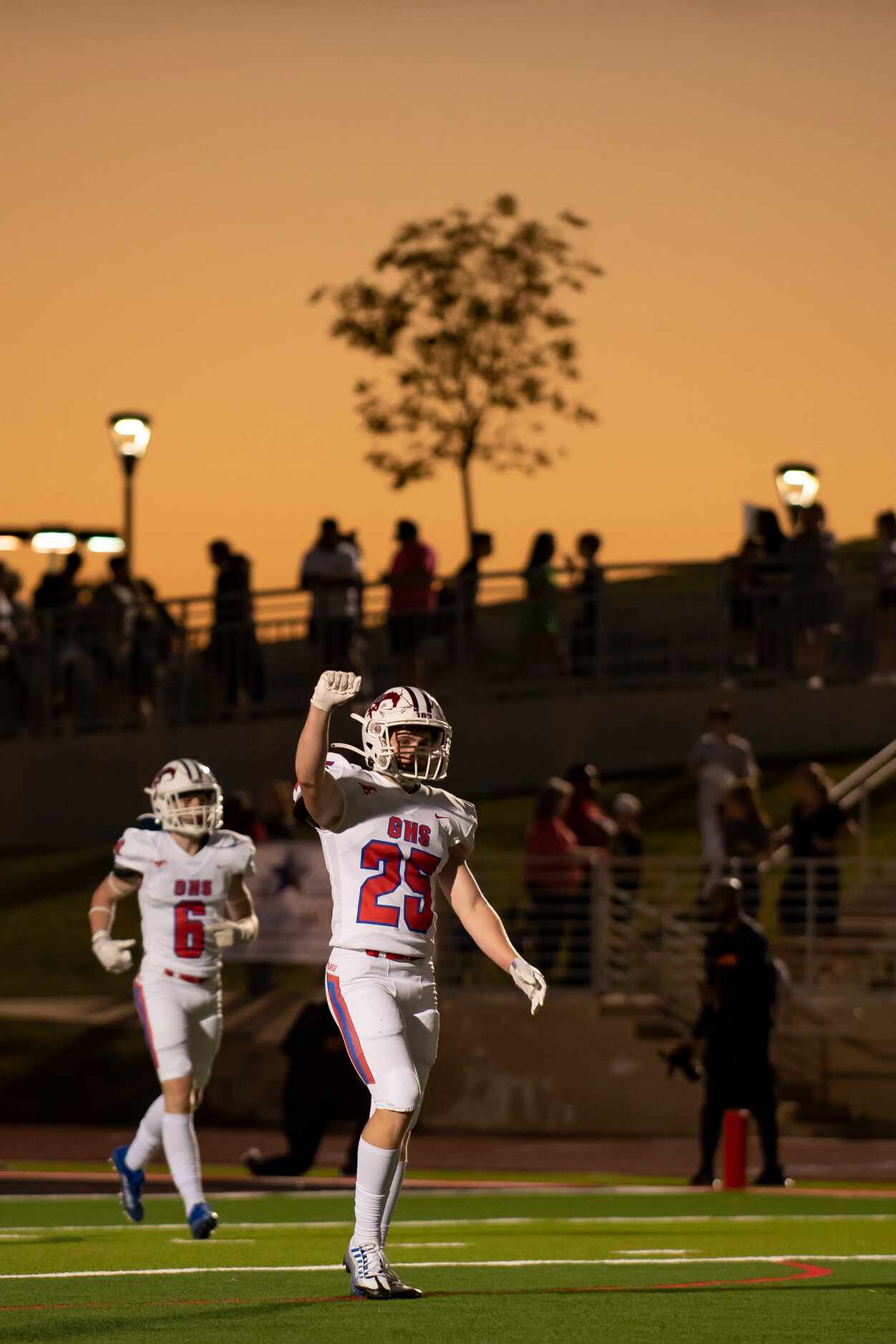 Grapevine senior Hunter Lasher (25) signals fourth down after making a play during a...