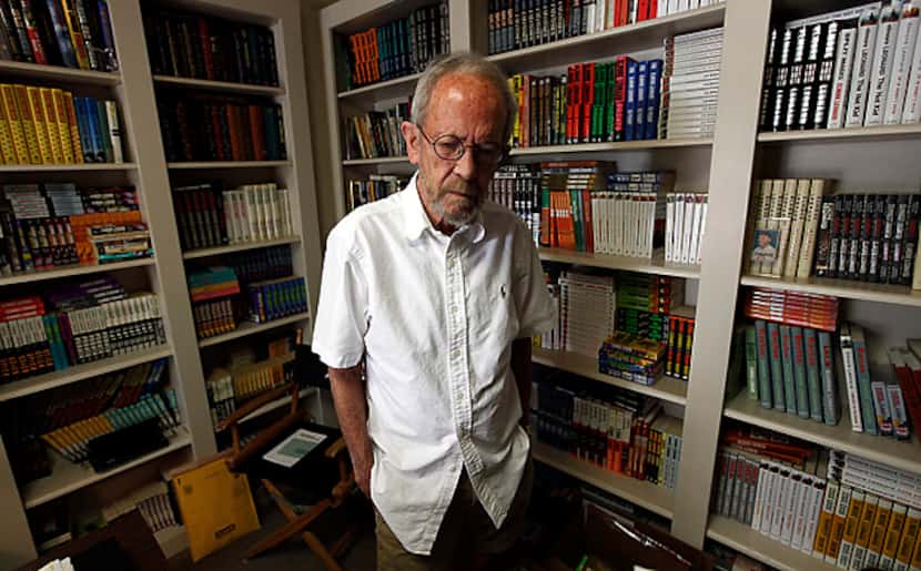 Best-selling crime novelist Elmore Leonard stands among shelves filled with books at his...