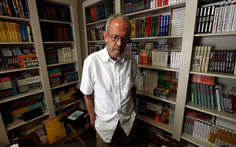 Best-selling crime novelist Elmore Leonard stands among shelves filled with books at his...