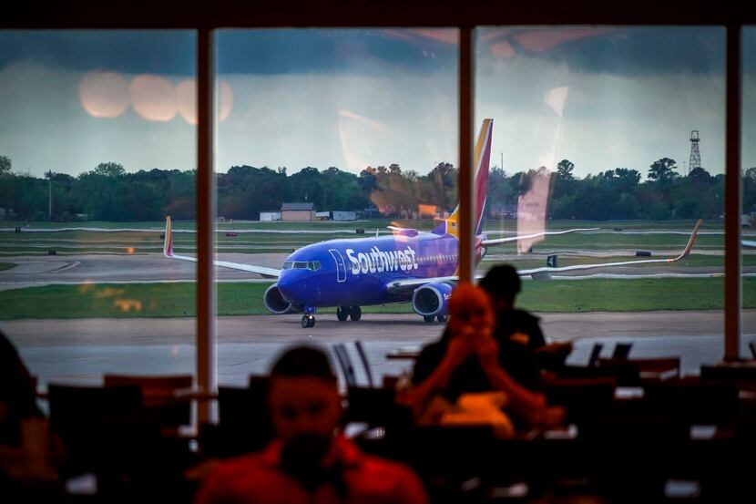 A Southwest Airlines plane taxis to the gate at Hobby Airport in Houston on Friday, March...