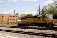 A Union Pacific engine sits on the track close to the Union Pacific Railroad building on...