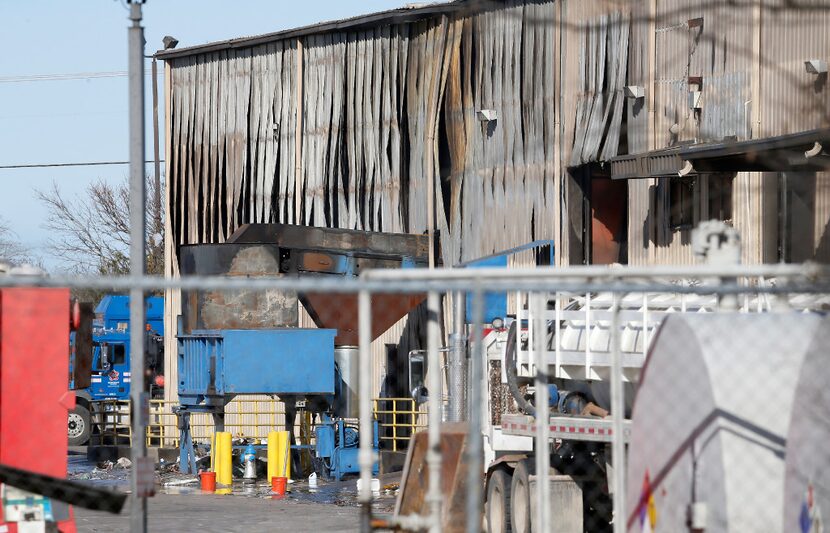 The building at Republic Services is damaged by the fire in Plano, Texas, Thursday, Dec. 29,...