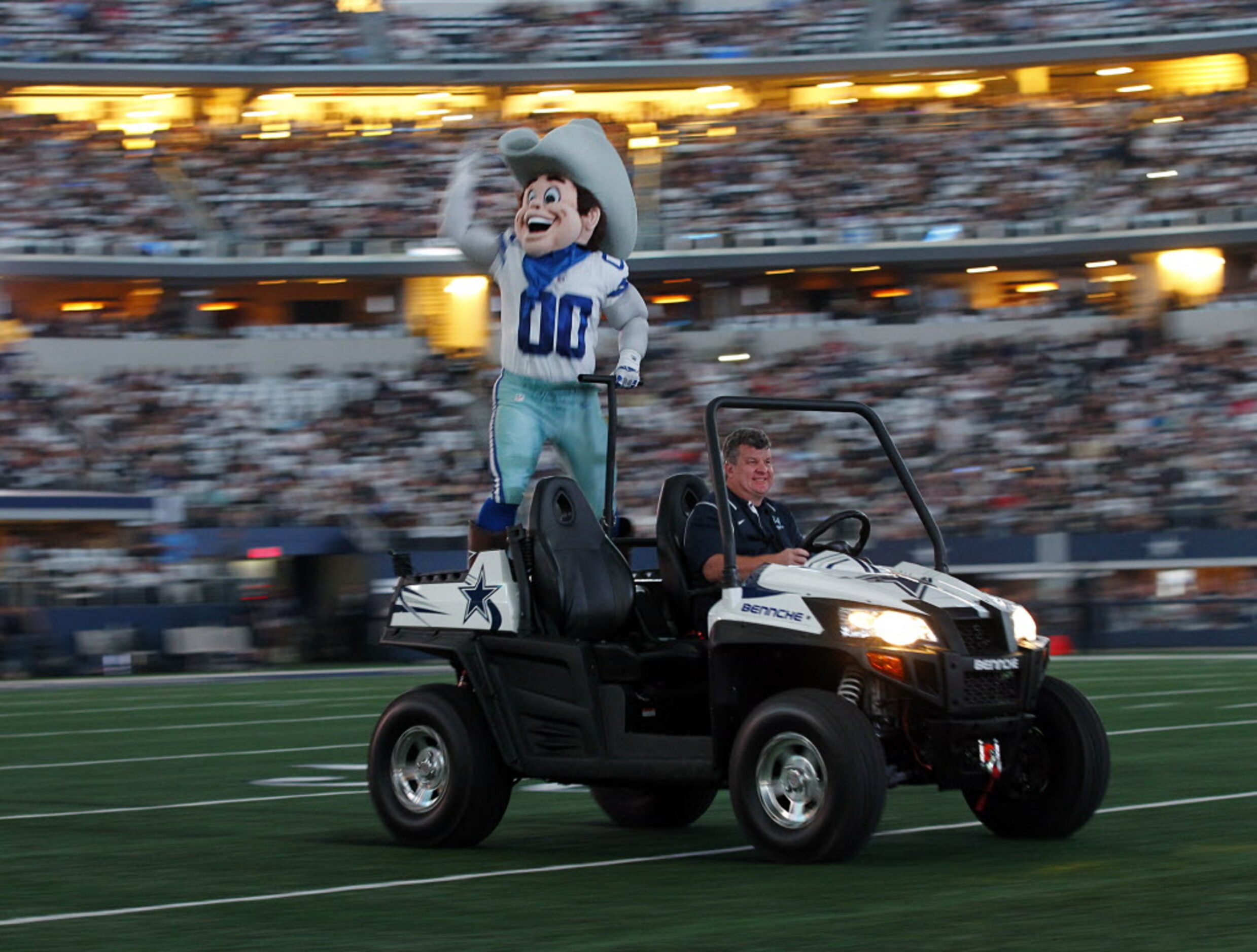 Dallas Cowboys mascot Rowdy receives a ride around the field to fire up the crowd before the...