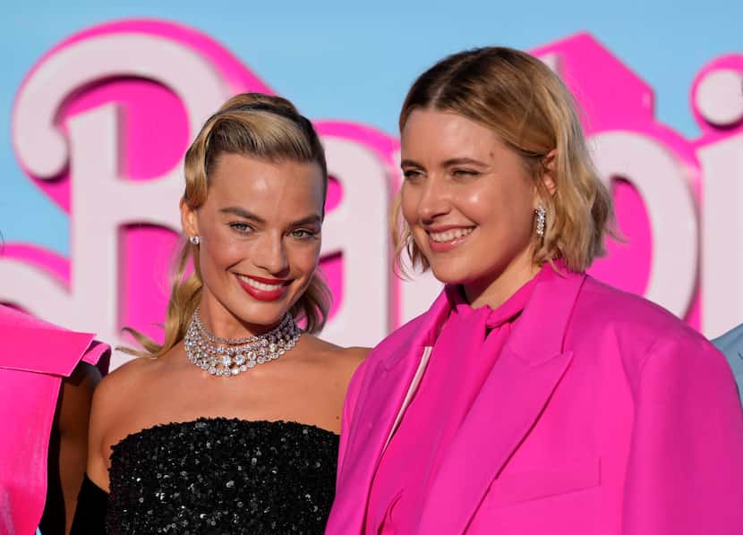 Margot Robbie, left, and writer/director/executive producer Greta Gerwig arrive at the...
