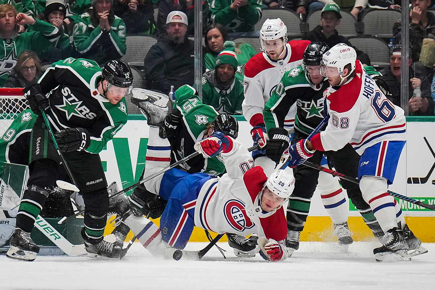 Montreal Canadiens left wing Juraj Slafkovsky (20) is taken down in front of the net by...