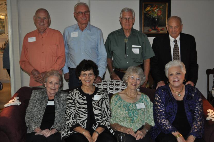 Husbands stand behind their wives at the 60th wedding anniversary celebration of "The...