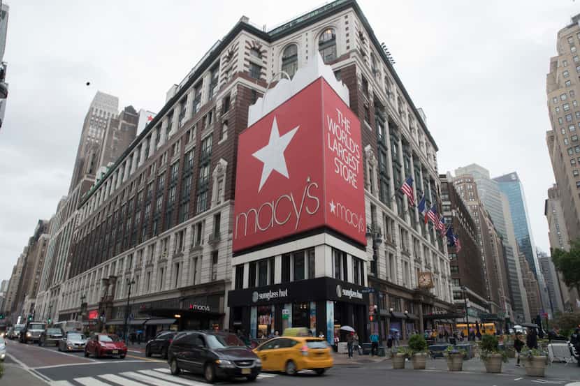 FILE- In this May 16, 2018, file photo, traffic makes it's way past the Macy's flagship...