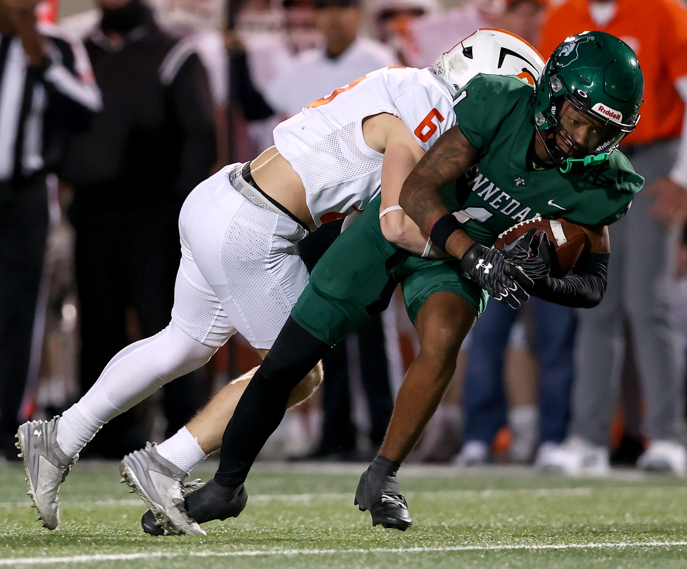 Kennedale wide receiver Laurrence Watkins (1) gets hit hard by Celina defensive back Jacob...