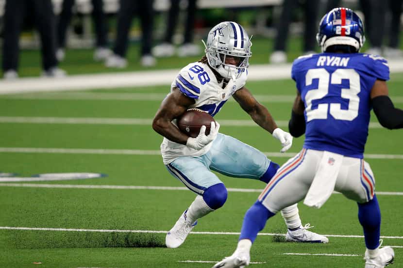 Dallas Cowboys wide receiver CeeDee Lamb (88) puts on the brakes as he avoids New York...